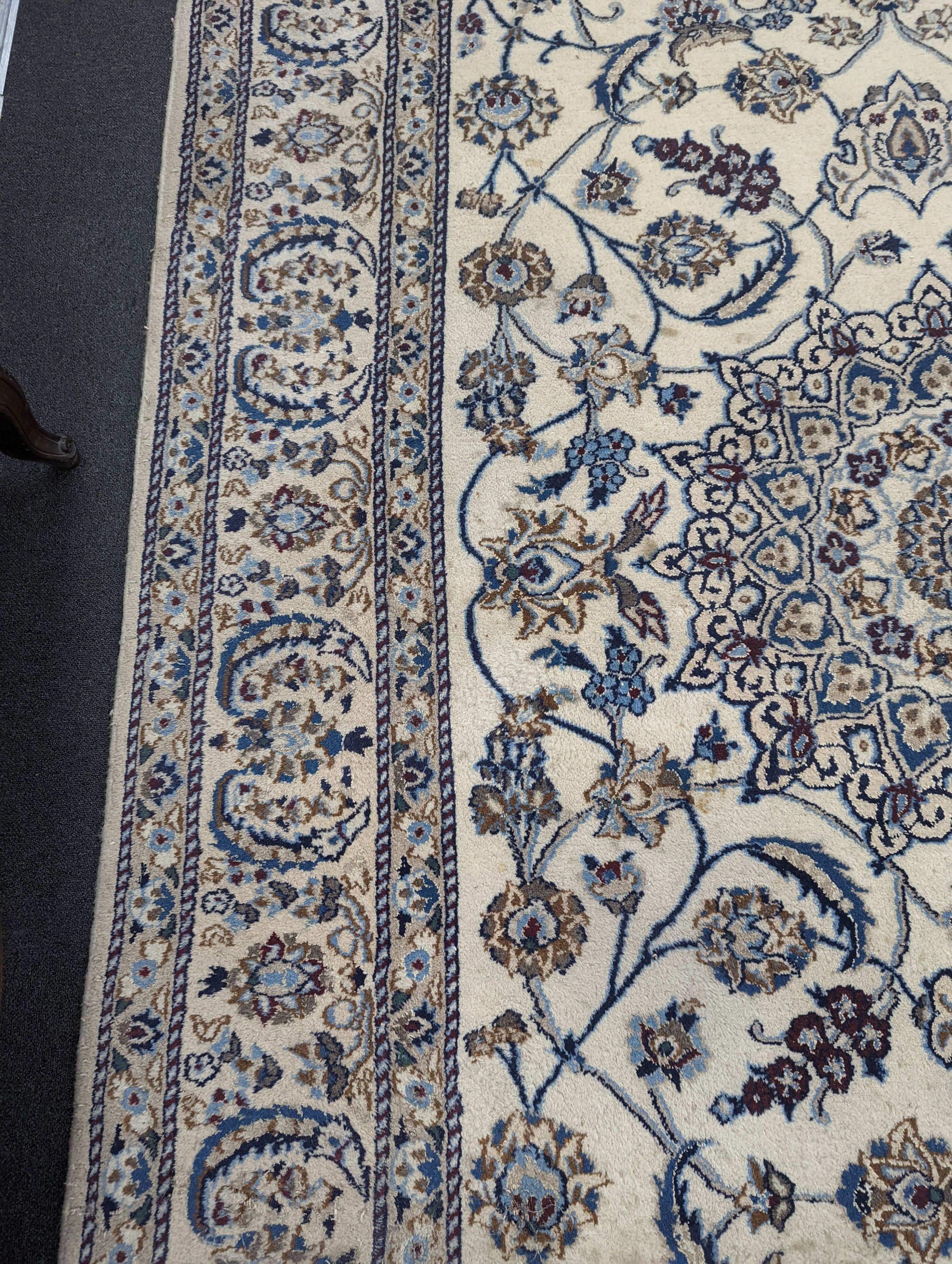 An ivory ground Nain carpet, 290 x 205cm